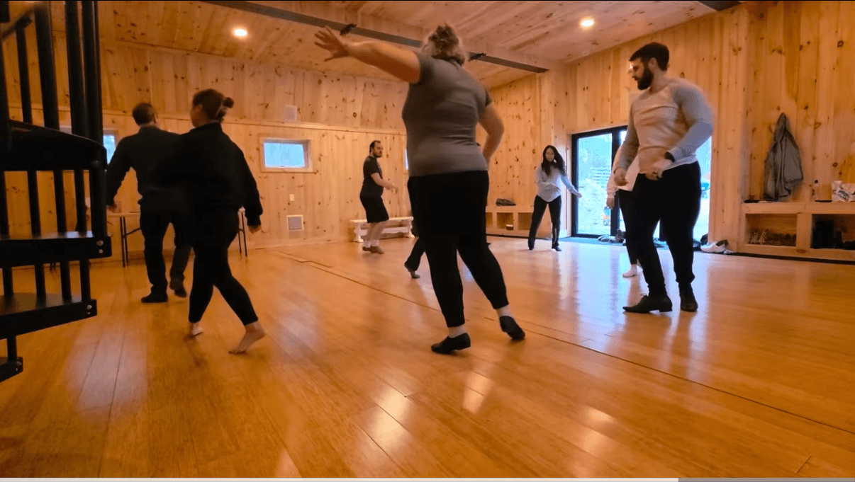 A real ballroom studio community dancing together during class.